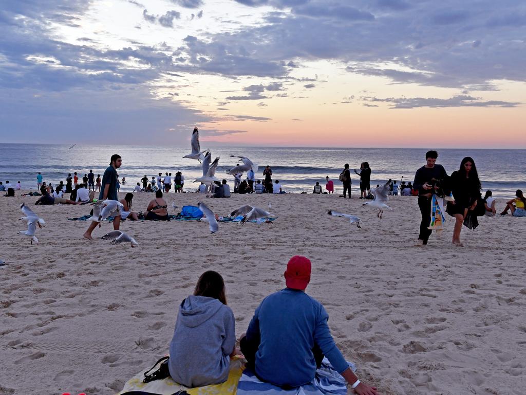 Revellers during the sunrise on New Years Day at Bondi Beach in Sydney. Picture: AAP