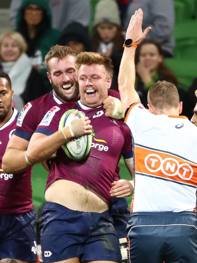 MELBOURNE, AUSTRALIA – MAY 10: Harry Hoopert of the Reds is congratulated by his teammates after scoring a try during the round 13 Super Rugby match between the Rebels and the Reds at AMI Park on May 10, 2019 in Melbourne, Australia. (Photo by Scott Barbour/Getty Images)