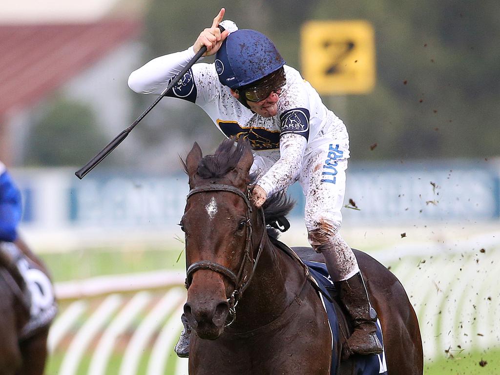 Jockey Ben Melham sticks his tongue out to the crowd as he and She Will Reign win the Longines Golden Slipper.