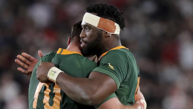 South Africa's captain Siya Kolisi, right, hugs teammate Handre Pollard after their World Cup final win. Picture: AP