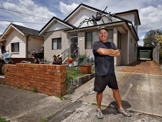 DAILY TELEGRAPH - 25/10/24 Home in Hampden Rd, Russell Lea which has a giant spider on the roof as Halloween decorations. 1 local lady has asked for it to be removed because she is scared. Neighbour, Perry Ferro pictured in front of the house. Perry loves the decorations. Picture: Sam Ruttyn