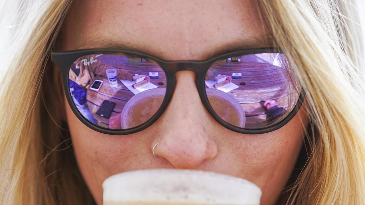 Naomi Bailey-Carpenter from St Ives in Cornwall, enjoys a drink at the Working Boat pub in Falmouth. (Photo by Hugh Hastings/Getty Images).