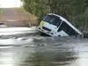 School bus swept into river after being driven through floodwaters