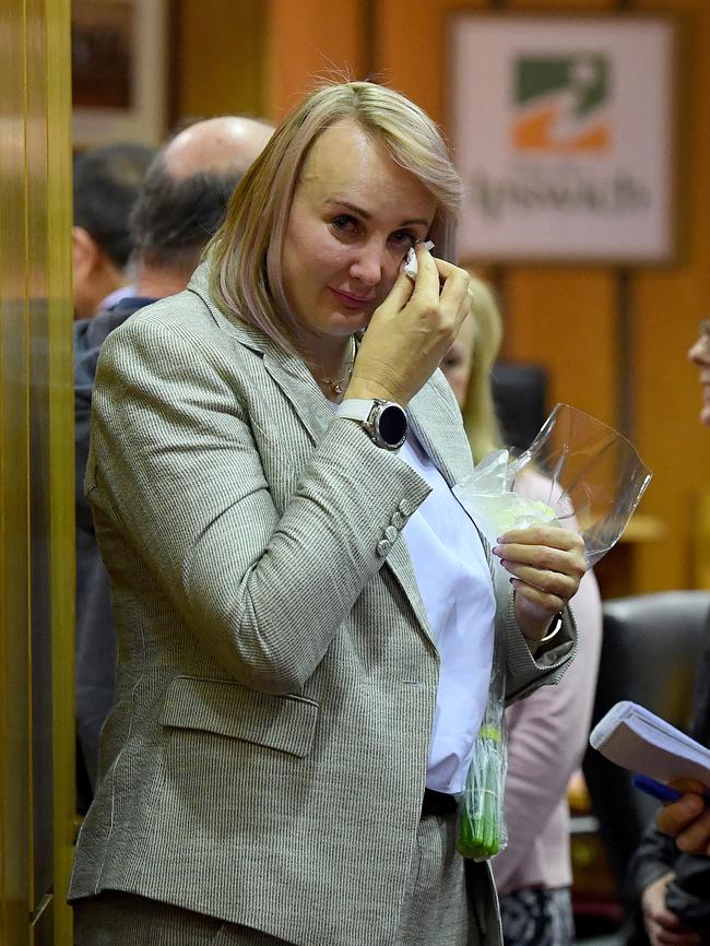 Cr Cheryl Bromage wipes away tears following the Ipswich City Council's final meeting at the Council Chambers. Picture: AAP Image/Dave Hunt