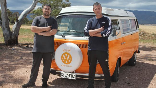 At Harry’s Home Made Fine Foods, brothers, Mitch, 37, and Archie, 45, Kanbanos, admire Nelson the Kombi. Picture Dean Martin