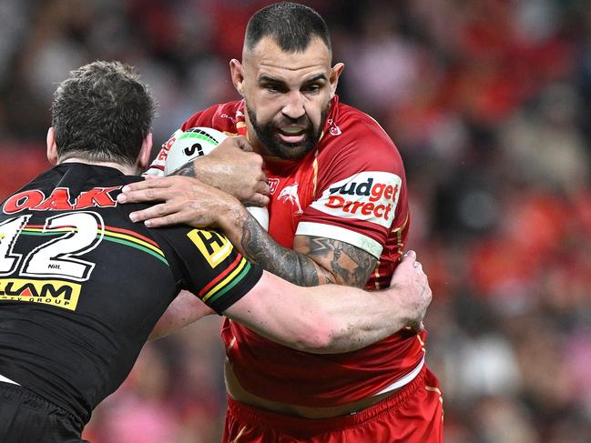 BRISBANE, AUSTRALIA - APRIL 10: Josh Kerr of the Dolphins takes on the defence during the round six NRL match between Dolphins and Penrith Panthers at Suncorp Stadium, on April 10, 2025, in Brisbane, Australia. (Photo by Bradley Kanaris/Getty Images)