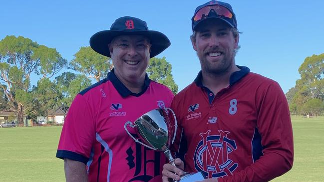 Warren Ayres presents the Warren Ayres Cup to Melbourne skipper Blake Thomson. Pic: Liz Williamson World of Photography