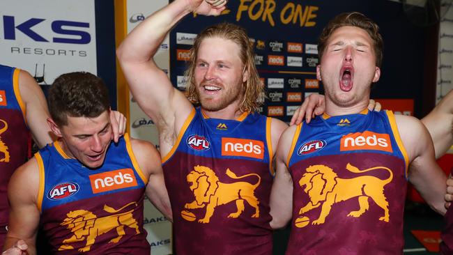 Dayne Zorko, Daniel Rich and Alex Witherden belt out the Lions song.