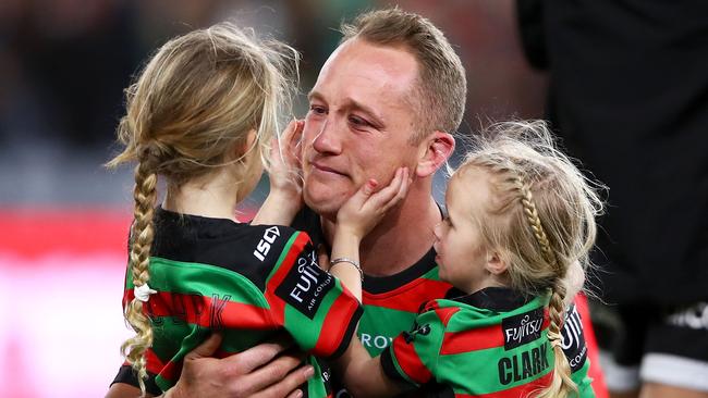 Jason Clark hugs his daughters Milla and Andi after the Rabbitohs’ nail-biting victory over the Dragons. Picture: Getty Images