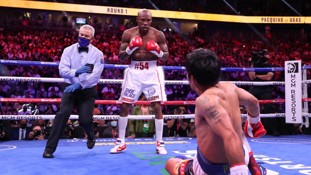 Manny Pacquiao (R) slips in the first round of a WBA welterweight title fight against Yordenis Ugas at T-Mobile Arena on August 21, 2021. Photo: Getty Images