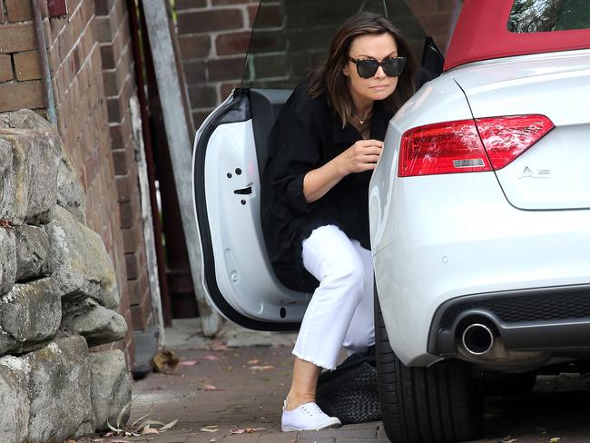 Lisa Wilkinson hid behind her Audi in her driveway last October after being hounded by the paparazzi following her decision to leave Today. Picture: Dimex