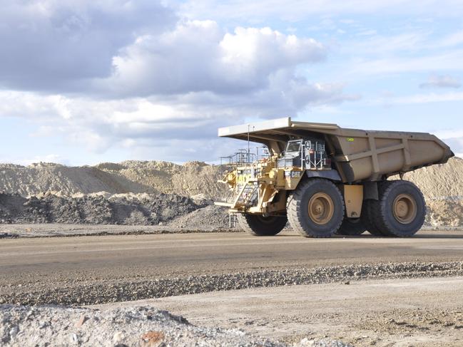 A dump truck heads out of a pit at New Acland coal mine. Photo: Stuart Cumming / The Chronicle