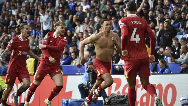 Liverpool's Trent Alexander-Arnold, second right, celebrates after scoring his side's opening goal during the English Premier League soccer match between Leicester City and Liverpool at King Power stadium in Leicester, England, Sunday, April 20, 2025. (AP Photo/Rui Vieira)