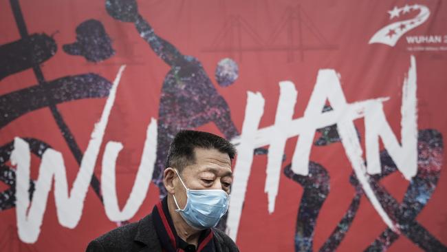 A masked man walks the streets of Wuhan. Picture: Getty Images