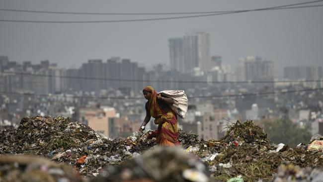 A garbage picker on the Ghazipur landfill in New Delhi, India. Picture: Getty Images