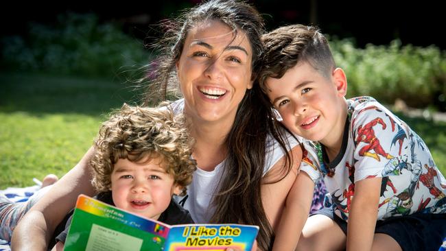 Belinda Small reading to her sons Jack and Noah. Picture: Jay Town