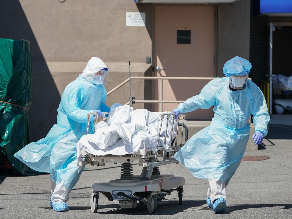 Bodies are moved to a refrigeration truck serving as a temporary morgue in Brooklyn in April 2020. Picture: AFP