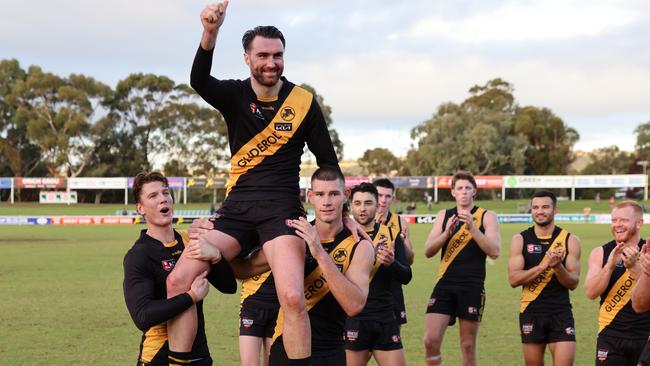 Triple Ken Farmer Medallist Liam McBean is chaired from the ground following his 100th game for Glenelg against Central District at Elizabeth Oval on Saturday. Picture: Supplied.