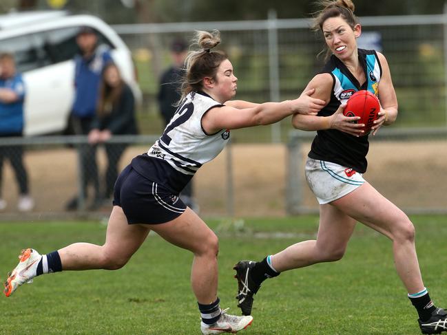 Amy Mitchener (right) of St Mary's under pressure from Bundoora’s Chloe Moorcroft Picture: Hamish Blair