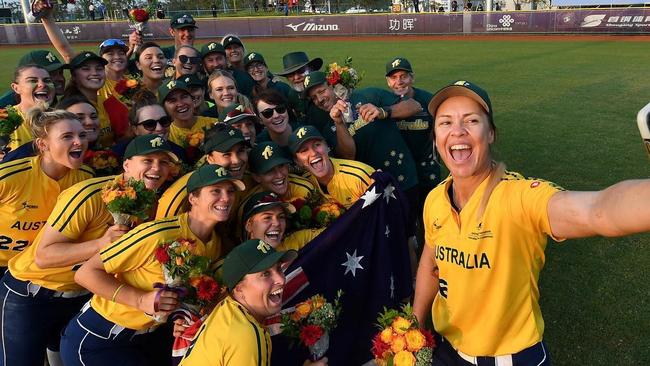 Australian women's softballers, including Belinda White, front, celebrate qualifiing for the Tokyo Olympics. Picture: Supplied, Softball Australia.