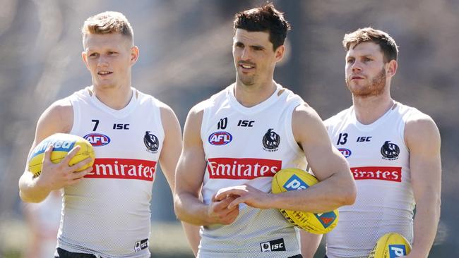 Adam Treloar, Scott Pendlebury and Taylor Adams in 2019. Picture: AAP Image/Michael Dodge