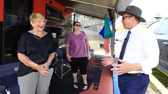 Queensland Premier Steven Miles and Labor candidate Naomi McQueentalks to a camper at the Cotton Tree Caravan Park on the Sunshine Coast. Picture: Adam Head