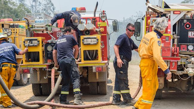 Fire fighters at Captain Creek, north of Bundaberg. Picture: AAP