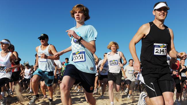 Runners on Newport Beach in 2009. Picture: Braden Fastier.