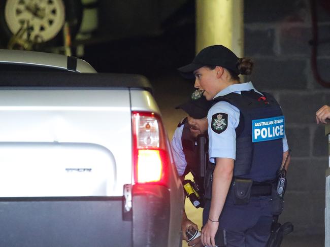 AFP seen checking a car as it enters the carpark of the CFMEU offices during a raid. Picture: Gaye Gerard