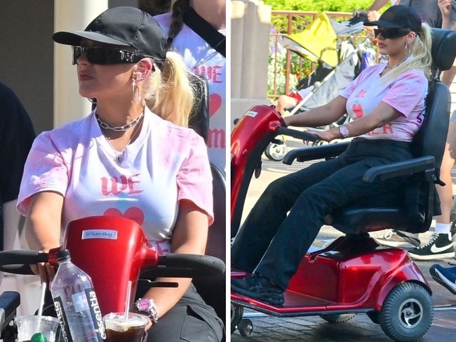 Christina Aguilera rides mobility scooter in Disneyland