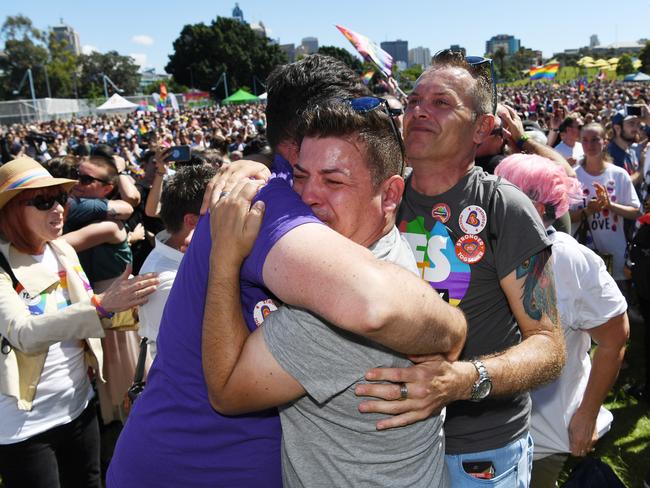 People celebrate after watching the same sex marriage vote result announcement during a picnic held by the Equality Campaign at Prince Regent Park in Sydney, Wednesday, November 15, 2017. Picture: AAP Image/David Moir