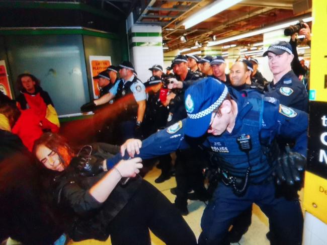 Police pepper spray protesters who refuse to move at Central railway station. Picture: Sam Ruttyn