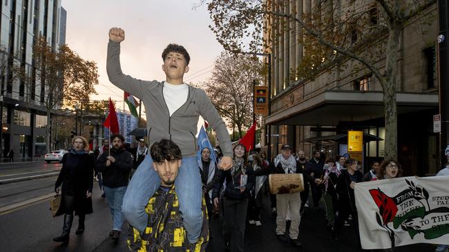 More than 100 people gathered and marched to the steps of parliament in protest of the interception of an aid ship headed for Gaza. Picture: Brett Hartwig