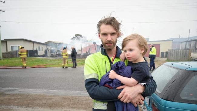 PRECIOUS PACKAGE: Postman Nick Lowe with his son Ciaran Lowe, who was rescued from a burning building by his mum. Picture: Kenji Sato