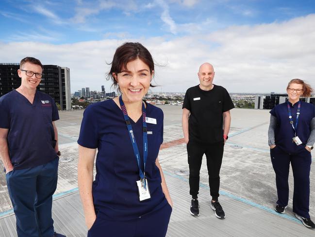 Trauma Health Workers from the Royal Melbourne Hospital on the Helipad to go with a feature about Trauma workers. L-R Mark Putland, Director of Emergency Medicine, Dr Cara Moore, ICU consultant, Chris Mullins Associate Nurse Unit Manager, Kellie Gumm, Trauma Program Manger.   Picture Rebecca Michael.