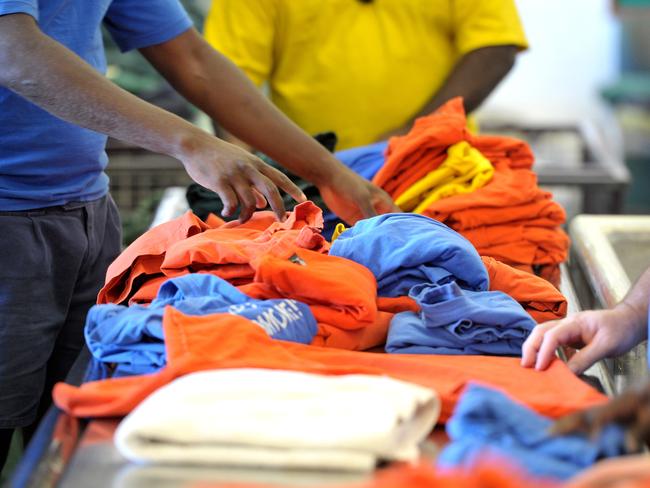 Prisoners working in the laundry at the Darwin Correctional Centre in Berrimah. Picture: Justin Sanson