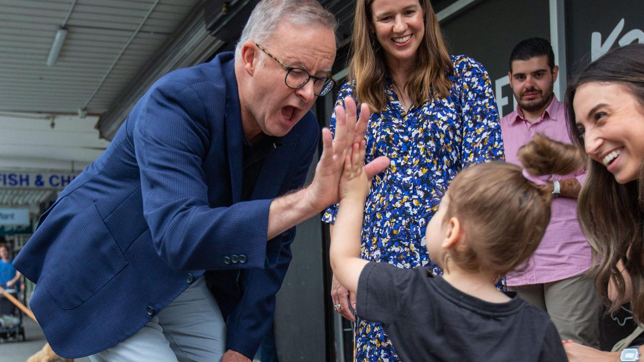 Mr Albanese shares a light moment with a young girl in Macleod. Picture: NCA NewsWire / Valeriu Campan