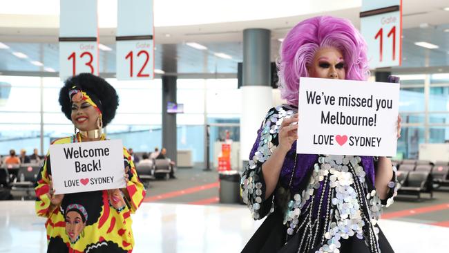 Coco Jumbo and Penny Traction welcome the first flight from Melbourne. Picture: NCA NewsWire / Damian Shaw