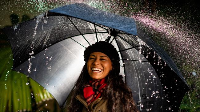 Darwin has already experienced nearly five times the September monthly average rainfall in 2020, with nine days still remaining in the month. Pictured is Natrisha Barnett ready for more rain. Picture: Che Chorley