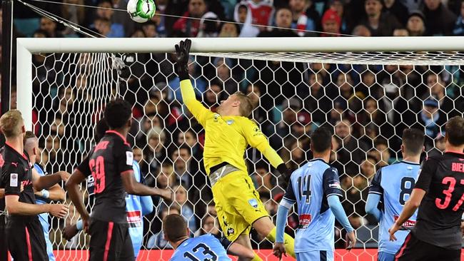 Sydney FC goalkeeper Andrew Redmayne makes a save against Sydney FC on Thursday night.