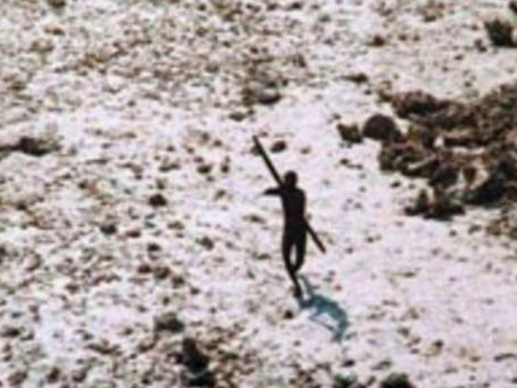 A Sentinelese tribesman points a spear at an overflying helicopter sent to inspect damage in the wake of the 2004 tsunami. Picture: Indian Coastguard/ Survival International