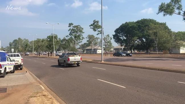 A dozen vehicles surround a NT resort in a manhunt