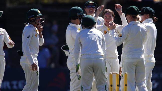 Amanda Wellington (3rd right) is congratulated by teammates after getting the wicket of England's Tammy Beaumont. Picture: AAP