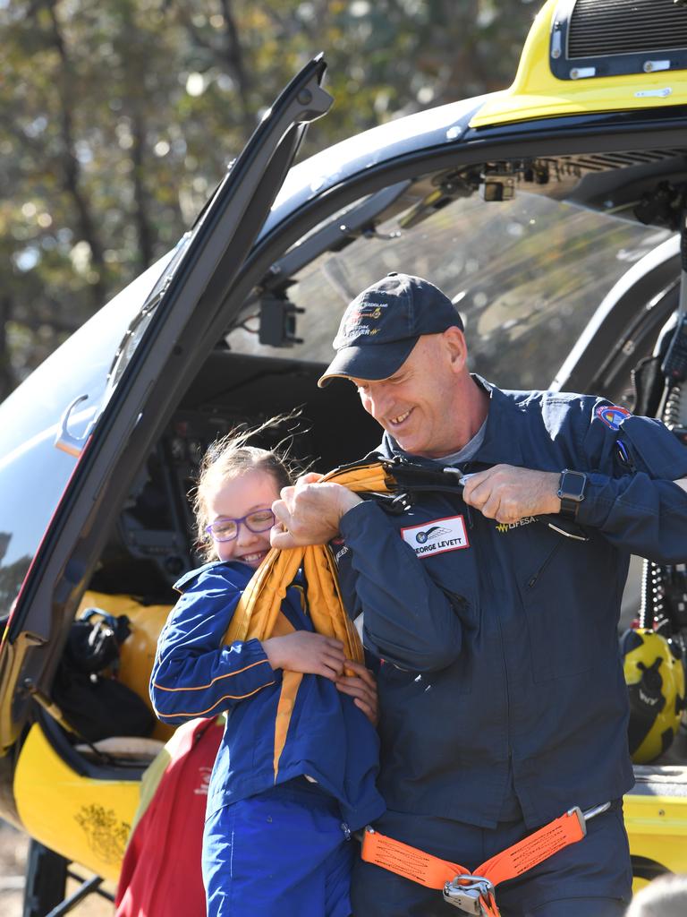 SLSQ Westpac helicopter staff pick up Mount Whitestone State School student Eliza Sutton in a demonstration. PHOTO: ALI KUCHEL