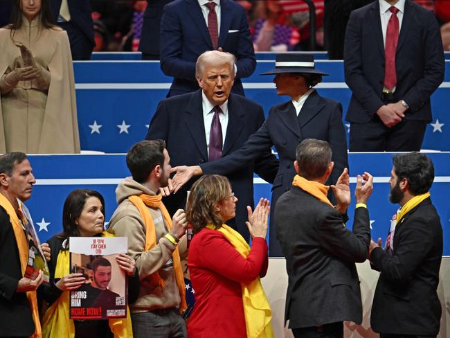 US President Donald Trump greets relatives of Israeli hostages taken by Hamas during the inaugural parade inside Capital One Arena. Picture: AFP