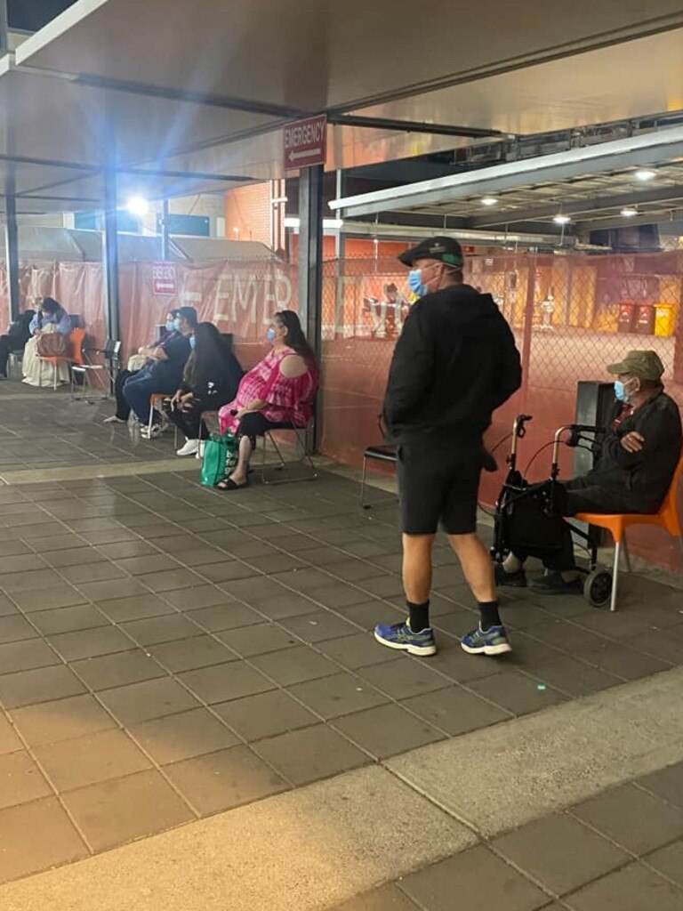 The 92-year-old sat outside with other waiting patients on Sunday night. Picture: Supplied