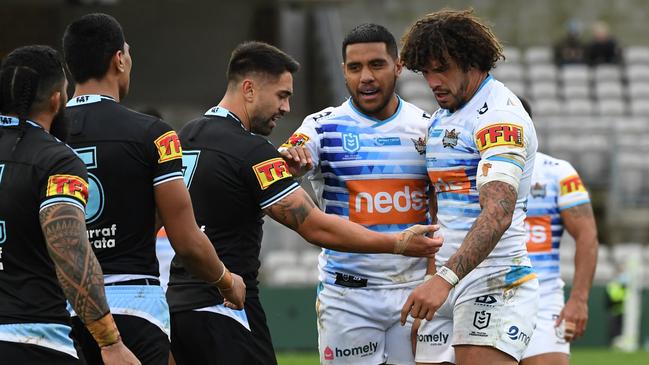 Shaun Johnson and Kevin Proctor argue over the alleged bite.