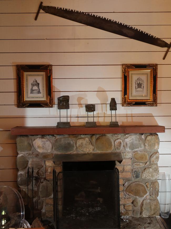 A cosy fireplace inside The Barn. Picture: Glenn Hampson.