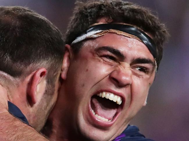 SYDNEY, AUSTRALIA - OCTOBER 01:  Dale Finucane of the Storm (R) celebrates with Cameron Smith (L) after scoring a try during the 2017 NRL Grand Final match between the Melbourne Storm and the North Queensland Cowboys at ANZ Stadium on October 1, 2017 in Sydney, Australia.  (Photo by Matt King/Getty Images)