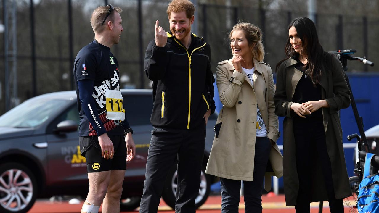 Prince Harry (second from left) and his wife Meghan (right) with Invictus Games UK Team chef de mission Jayne Kavanagh. Picture: Ben Stansall/AFP